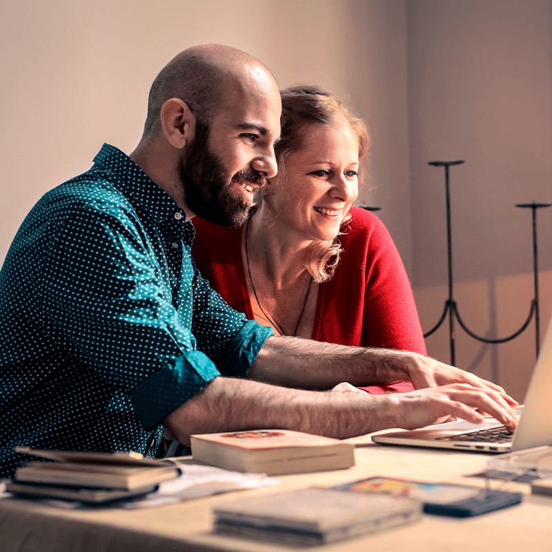 Couple looking at the computer.